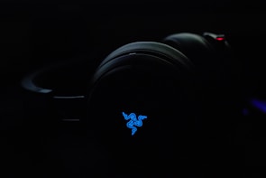 A high-tech wireless headphone set with subtle blue LED accents.