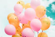 low-angle photo of pink and orange balloons