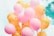 low-angle photo of pink and orange balloons