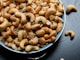 cashew nut lot on blue ceramic bowl