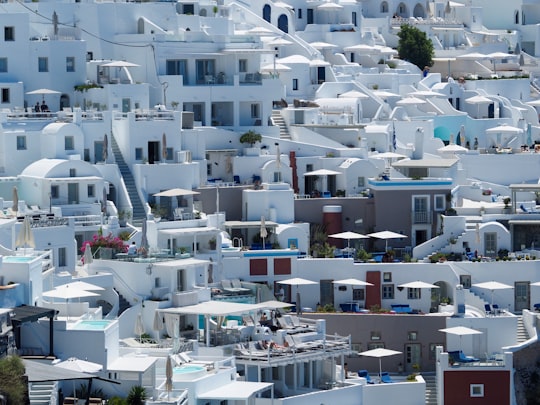 aerial photography of white concrete houses in Imerovigli Greece