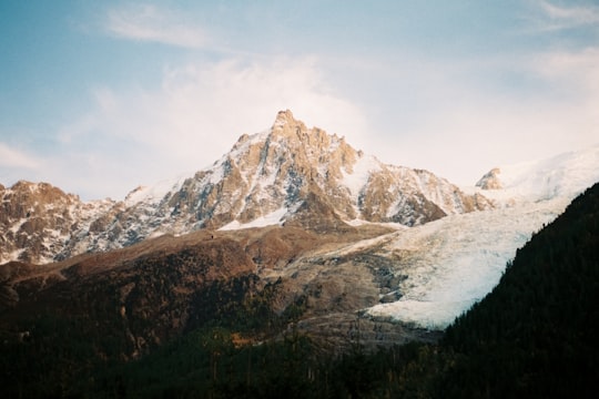 brown mountain covered by snow under cloudy sky during daytime in Mont Blanc Tunnel France