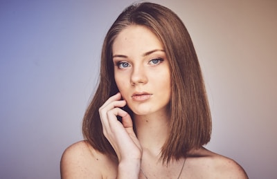 woman with her hand on cheek