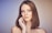 woman with her hand on cheek