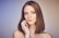 woman with her hand on cheek