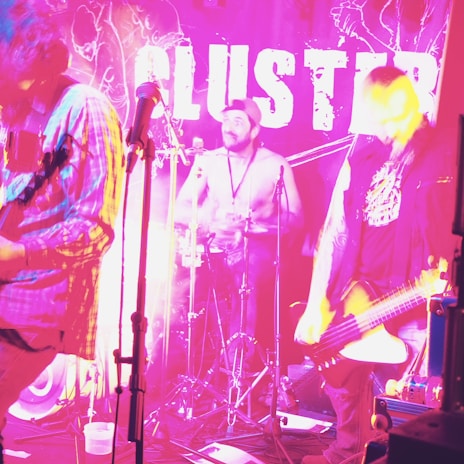 A vibrant concert scene with musicians performing on stage.