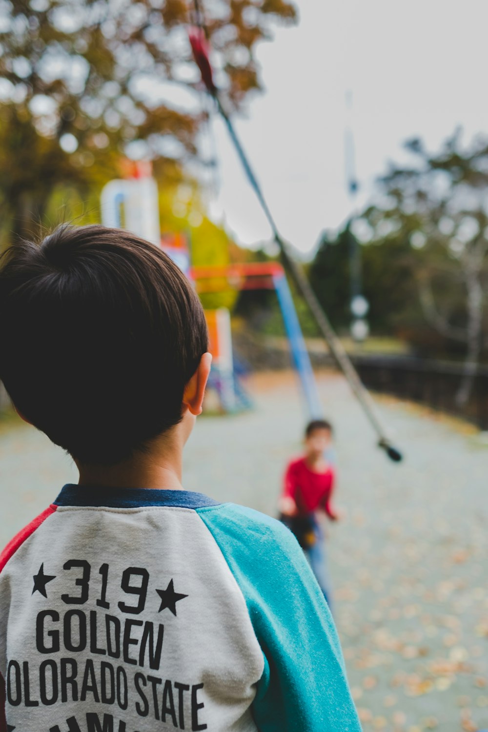 selective focus shot of child in playground