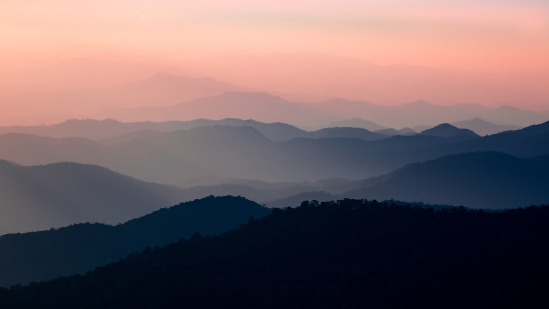 landscape photo of mountains, We reached the top of the mountain outside Chaing Mai and soaked in the sun setting over t