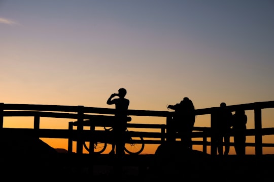 silhouette photo of persons taking photo of sunset in Braga Portugal