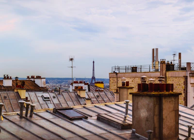 Sunny terrace overlooking Troyes rooftops, perfect for relaxing.