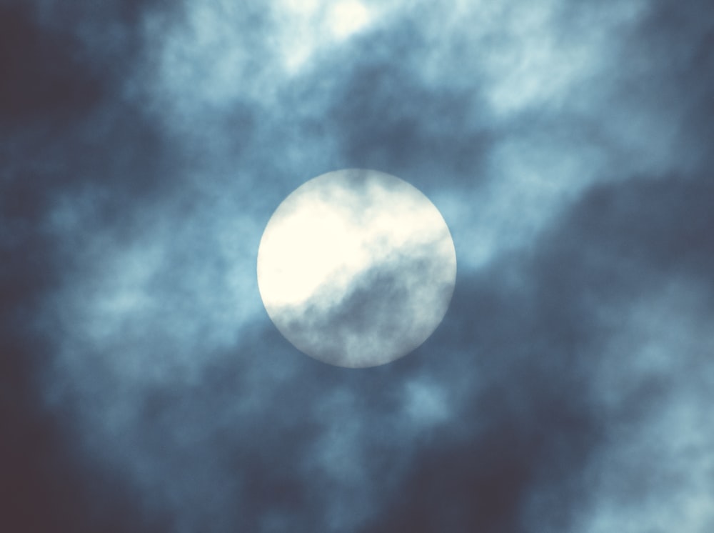full moon covered by clouds