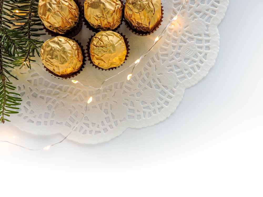 a white plate topped with chocolate covered cupcakes