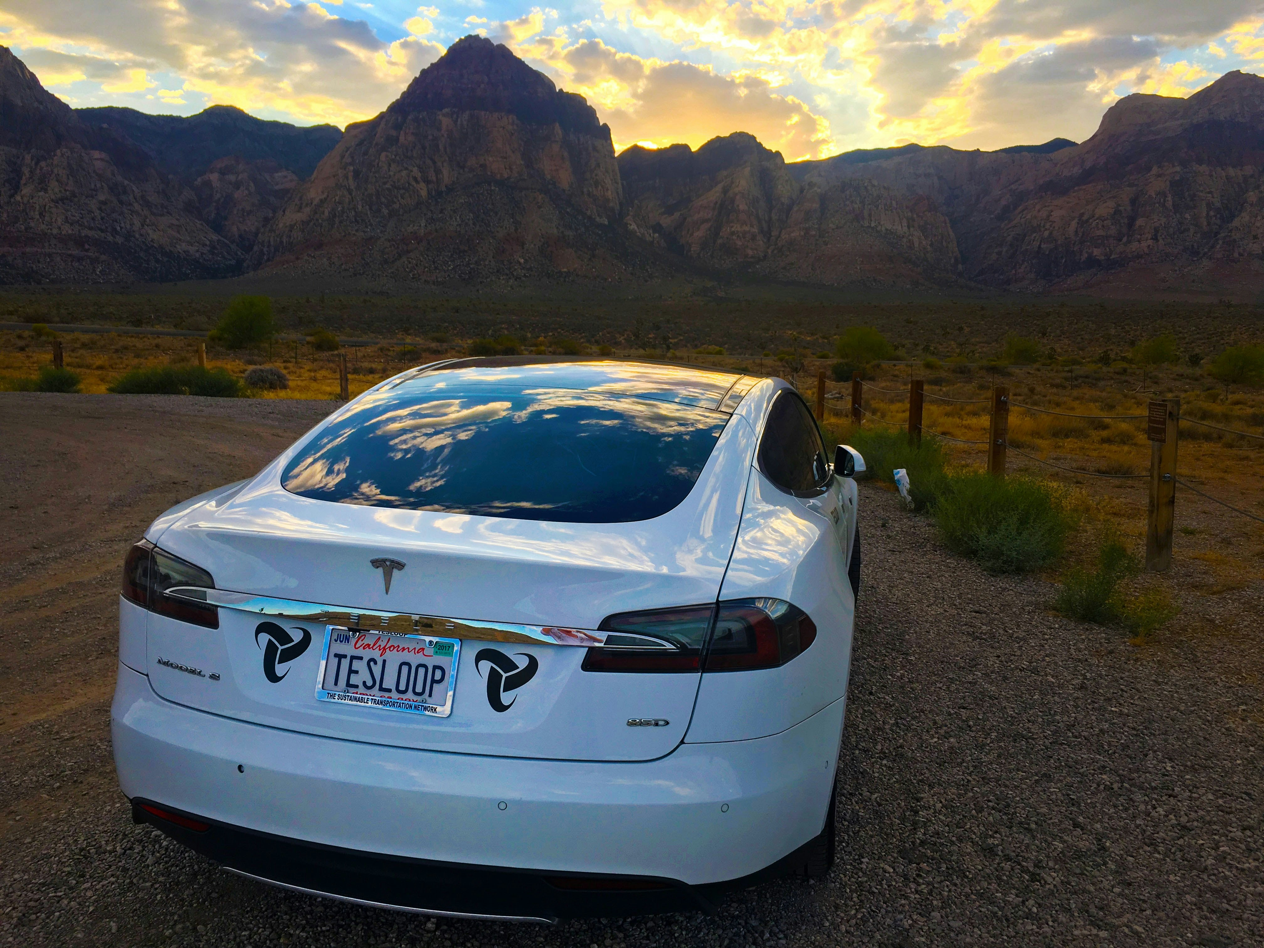 Tesla Model S with ceramic window tint, sleek dark glass, Arizona desert background, luxury automotive detail