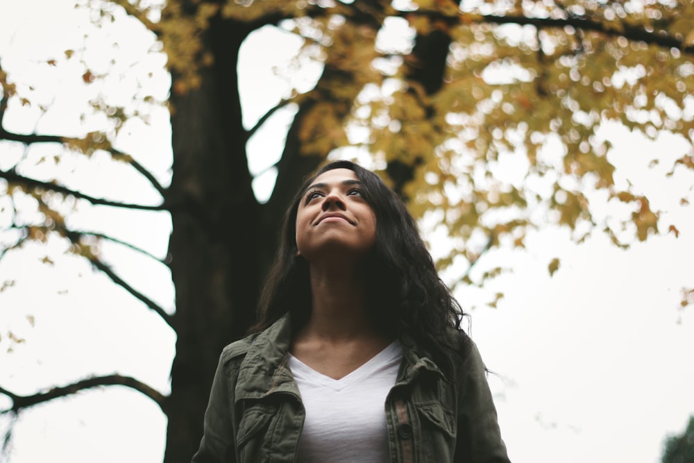 woman standing near tree during daytime