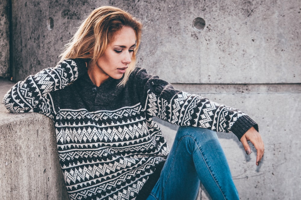 woman sitting on floor at daytime