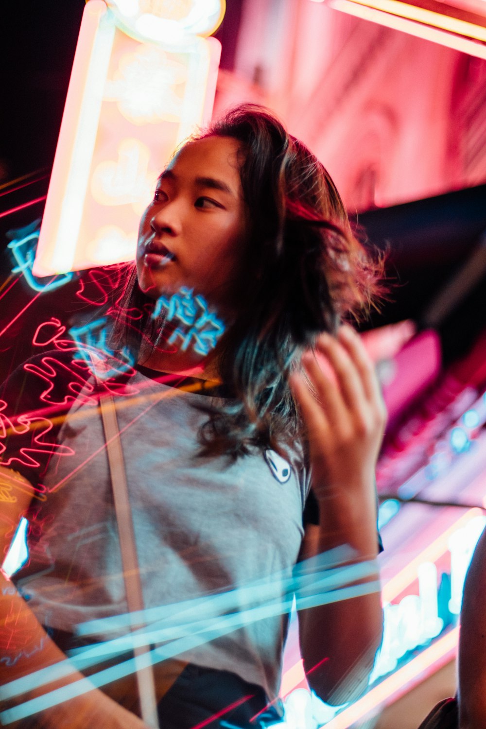 woman standing near red lights