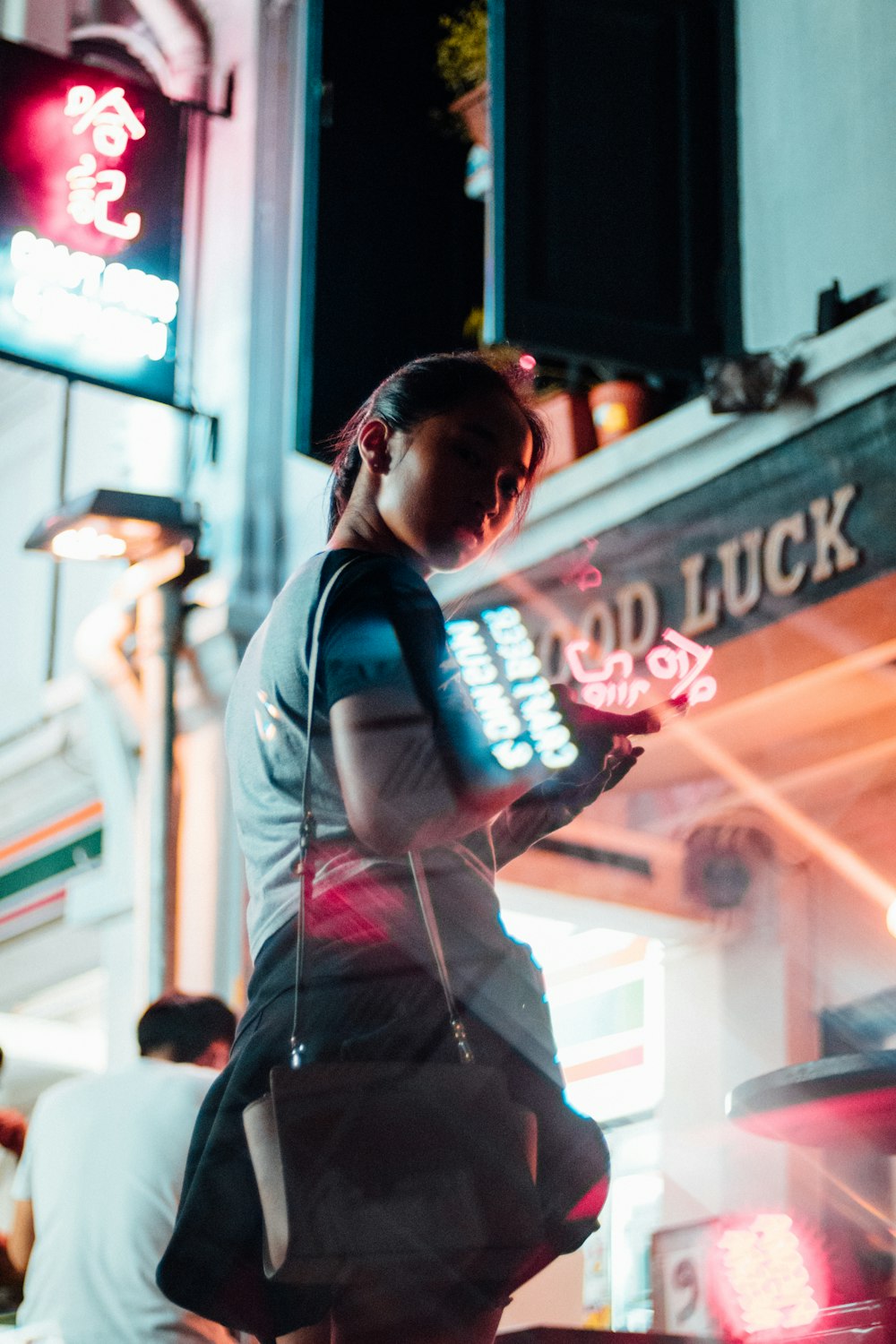 woman standing next to a store