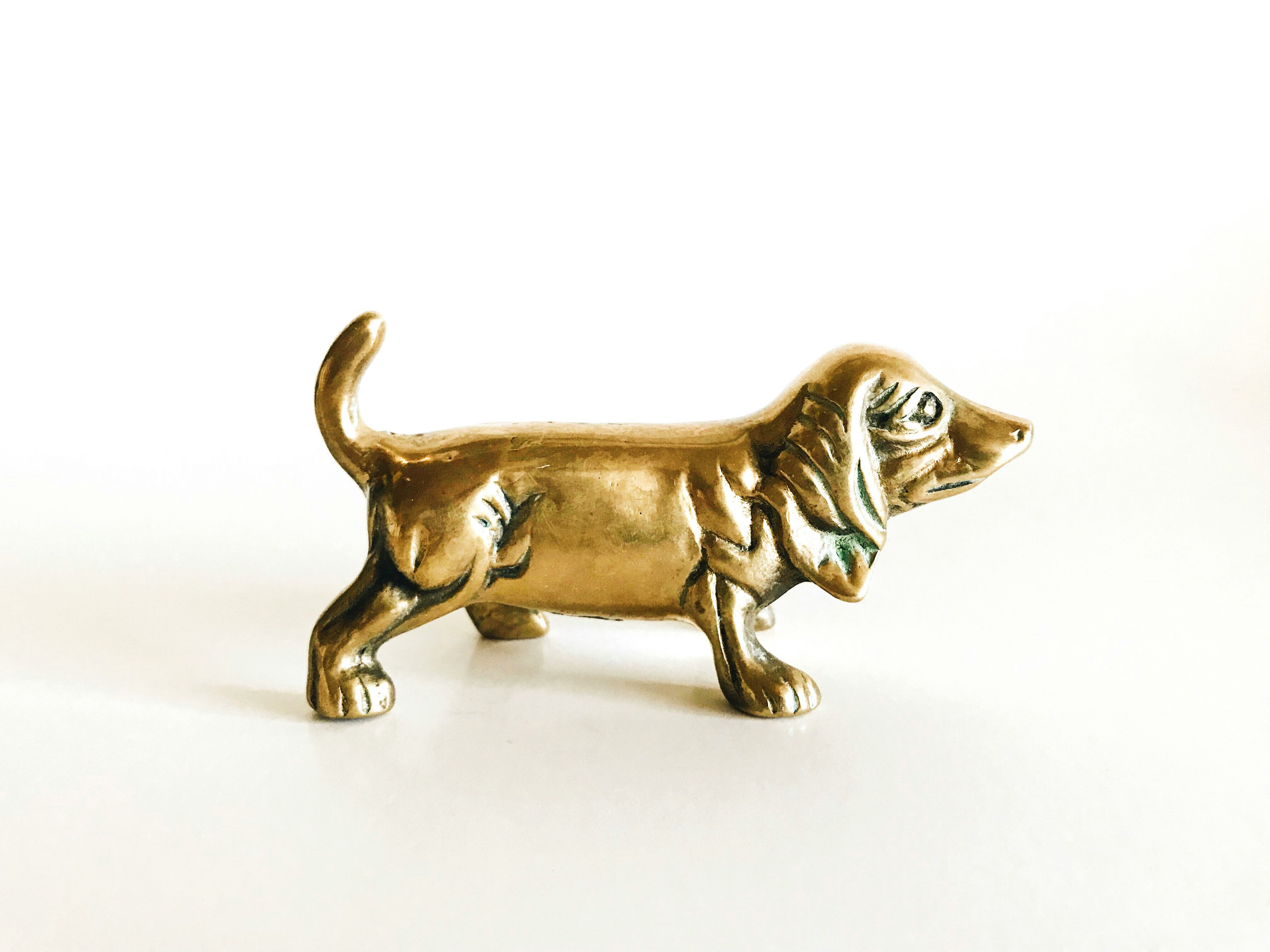 brown wooden dog figurine on white surface