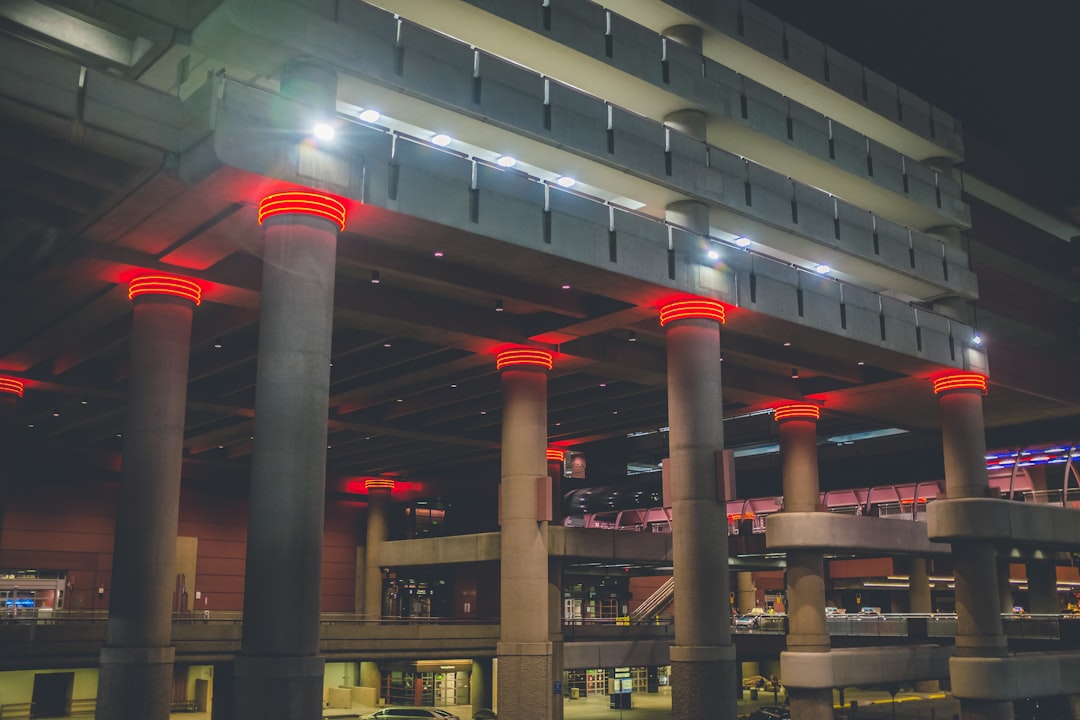 gray and red building at night,
