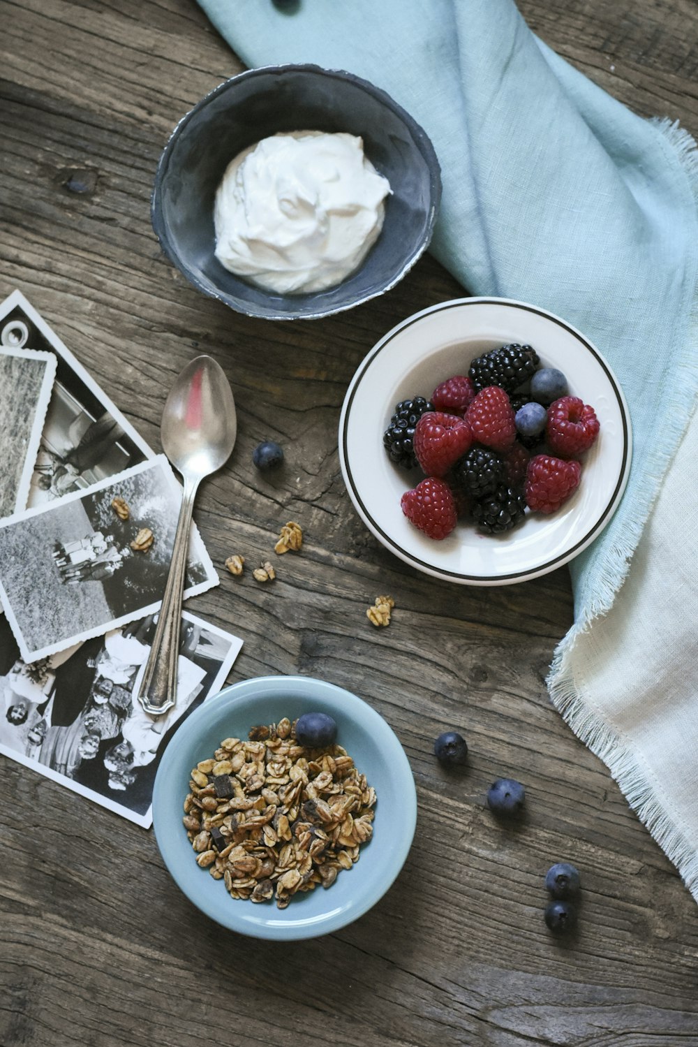 flat lay photograph of raspberries and whip cream