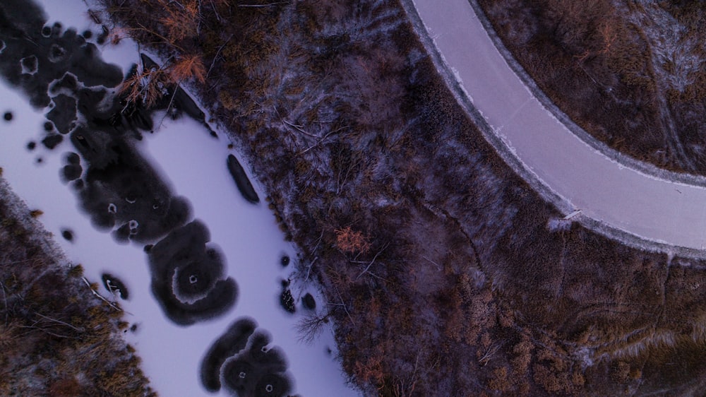 an aerial view of a snow covered road