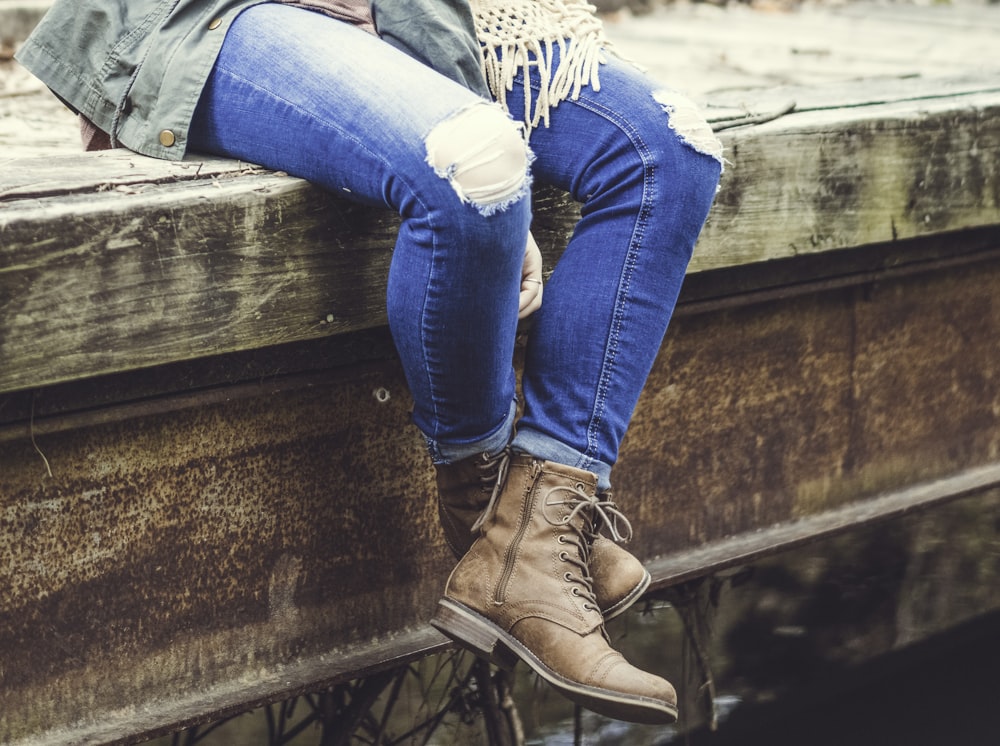 person sitting on boat dock