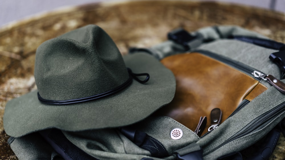 round hat on gray bag