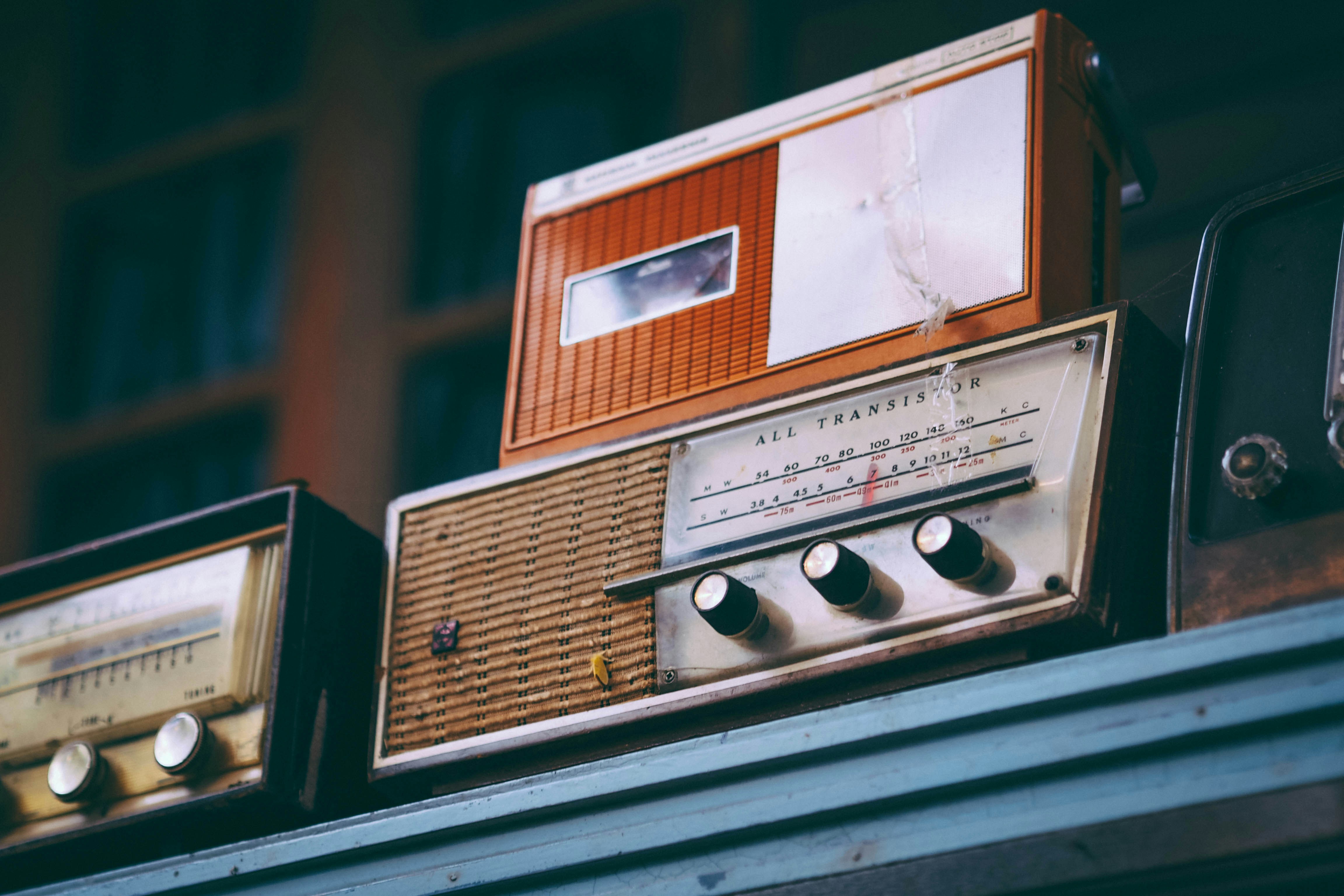 gray and brown transistor radio on table