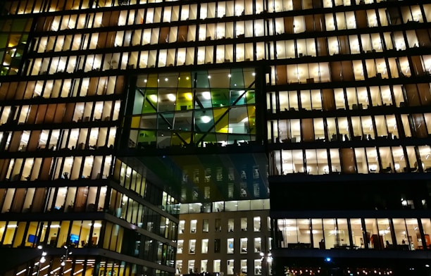 A modern office building with workers coordinating on site, representing Express's workforce hub.