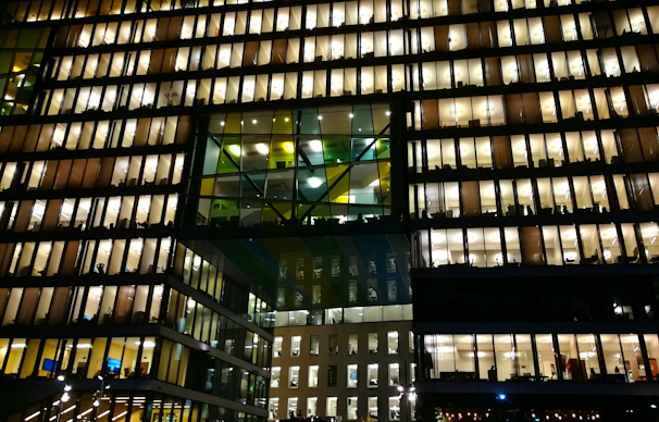 A modern office building with visible smart automation panels and digital interfaces.