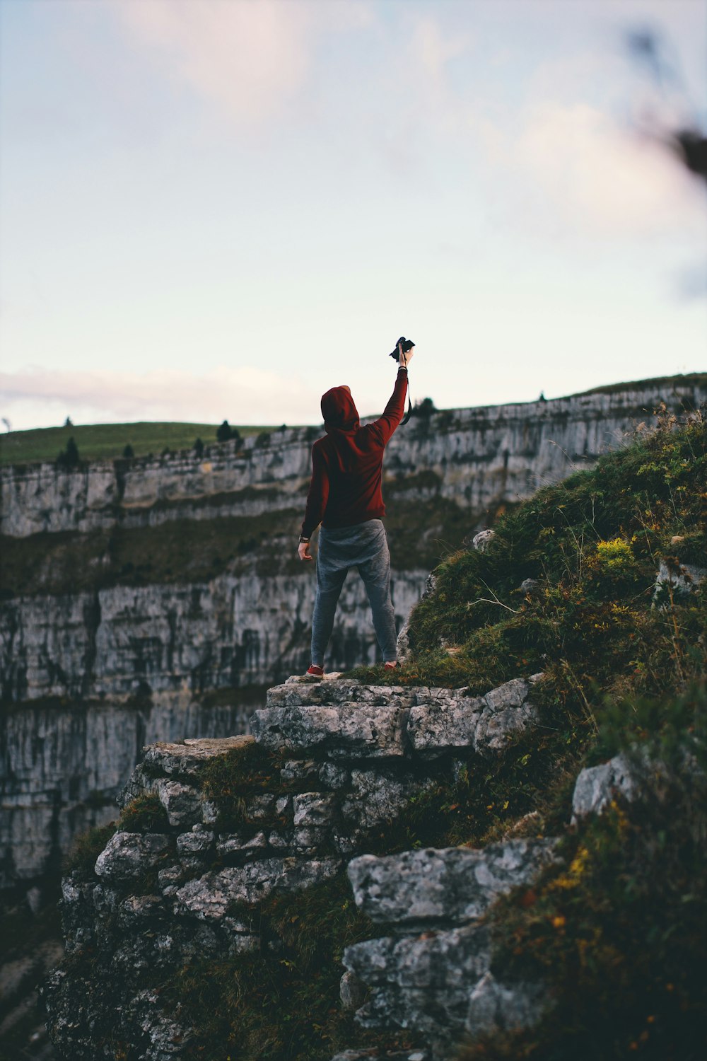 man standing on cliff