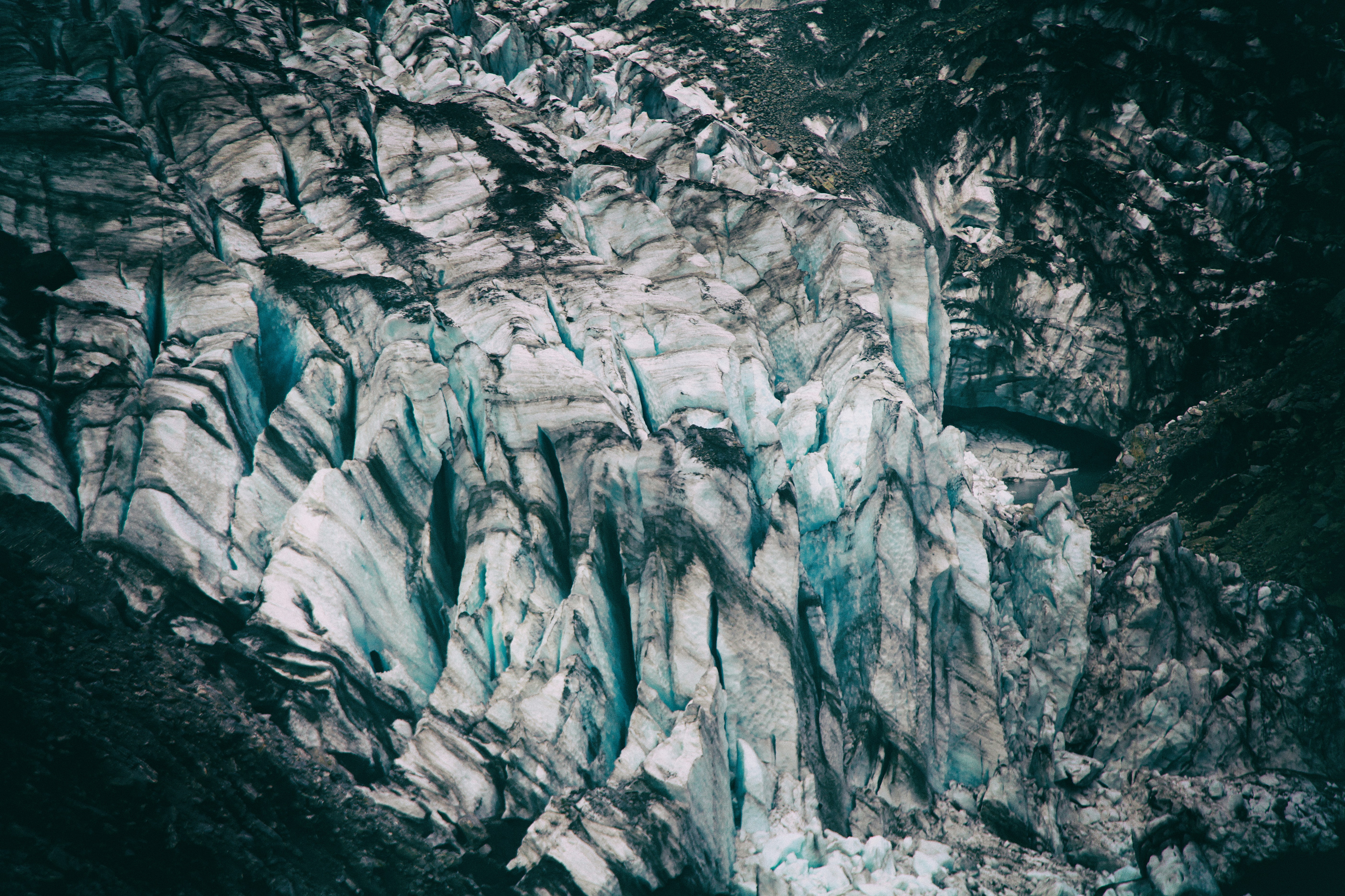 bird's eyeview photo of alp mountains covered in snow