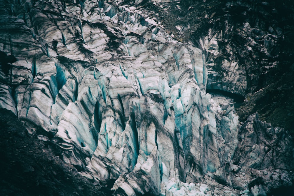 bird's eyeview photo of alp mountains covered in snow