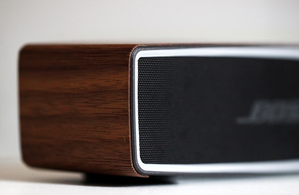 selective focus photography of black Bose speaker