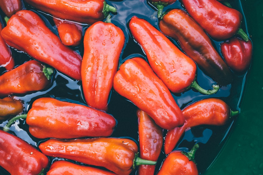 red bell pepper on body of water