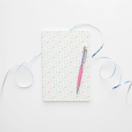 A personalized notebook featuring a funny caricature and a customer’s name.