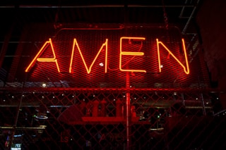 red Amen lit-up signage