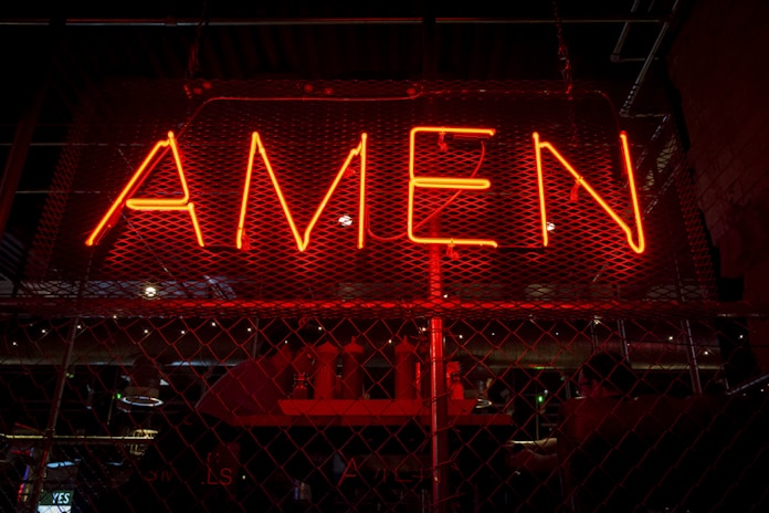 red Amen lit-up signage