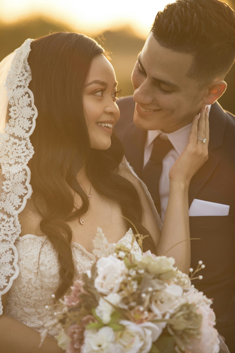 bride and groom smiling each other photo