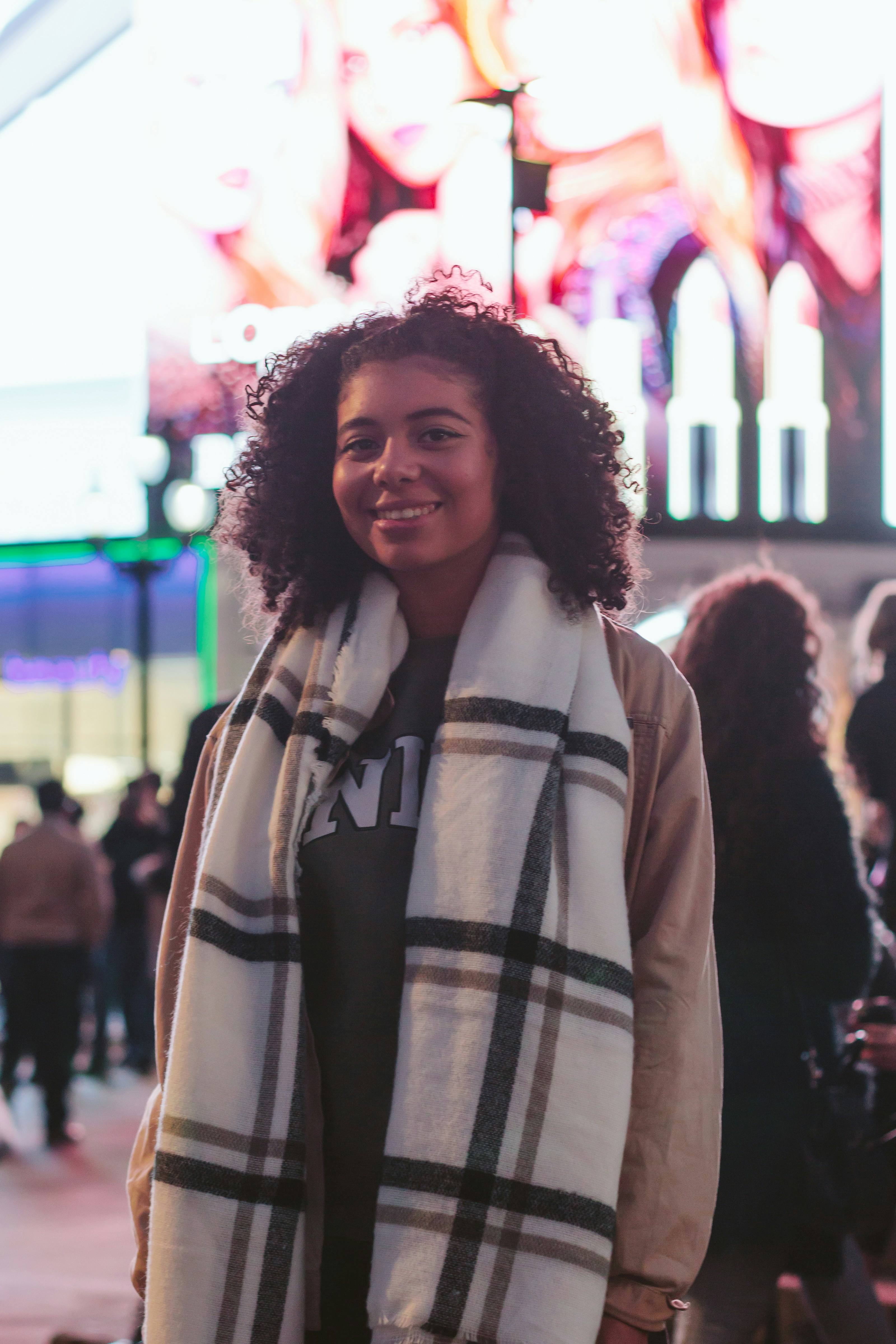 Smiling Woman Wearing Black And White Crew Neck Shirt With White