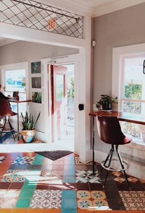 Bright room with colorful tiles and a comfortable seating area.