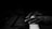 Close-up of hands playing a piano keyboard in a softly lit studio.