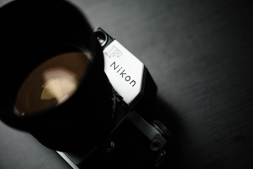 closeup photo of gray and black Nikon camera