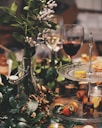 clear glass 2-tier plate beside flower arrangement