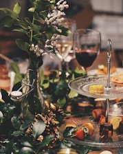 clear glass 2-tier plate beside flower arrangement