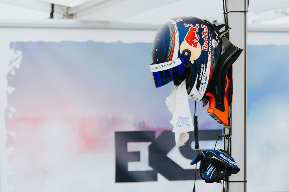 blue and white Redbull full-face helmet