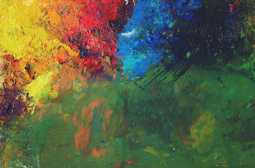 A vibrant abstract painting bursting with swirling blues, reds, and yellows, showcasing Dara Alter's mastery of color and texture.