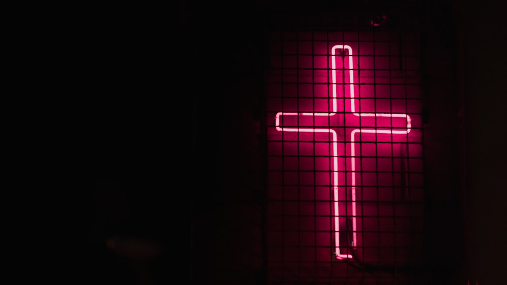 pink cross neon signage