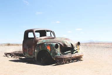 wrecked single cab pickup truck on field
