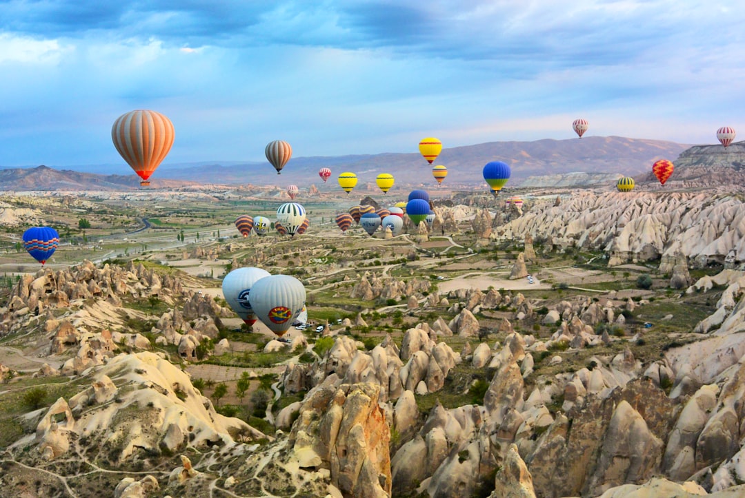photo of assorted-color air balloon lot in mid air during daytime